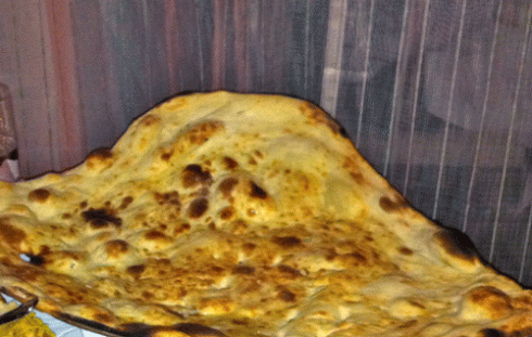 The "family naan" which our waiter assured us was big enough to feed the table. He didn't specify how big the table had to be. The "family naan" which our waiter assured us was big enough to feed the table. He didn't specify how big the table had to be.